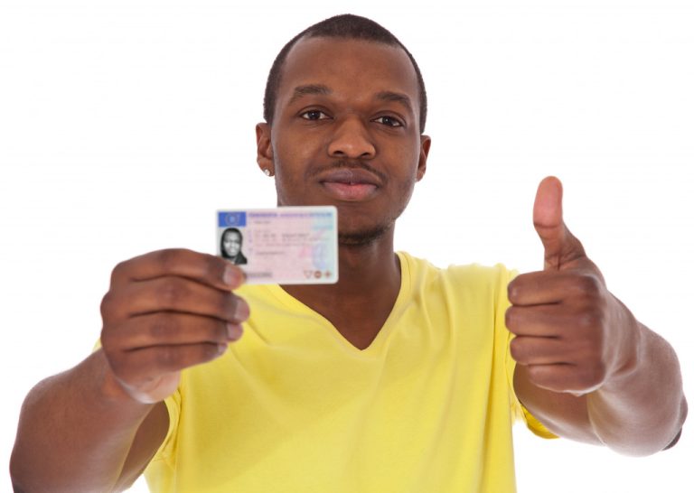 a man showing off his driver's license